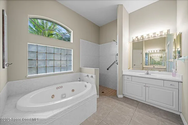 a bathroom with a bathtub and a sink