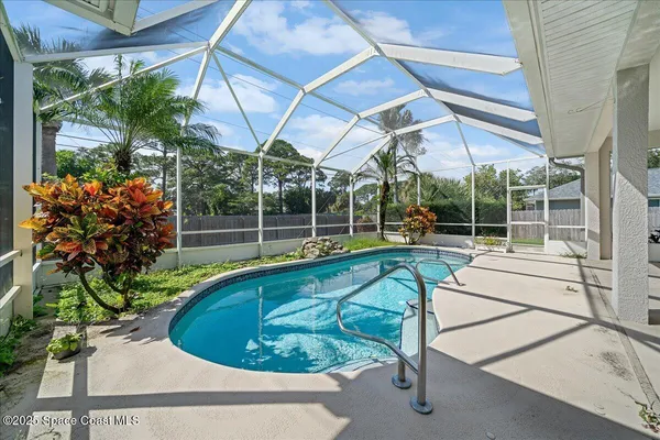 a view of a swimming pool with a patio