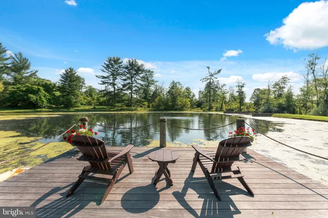 a living room with lots of furniture and a large window