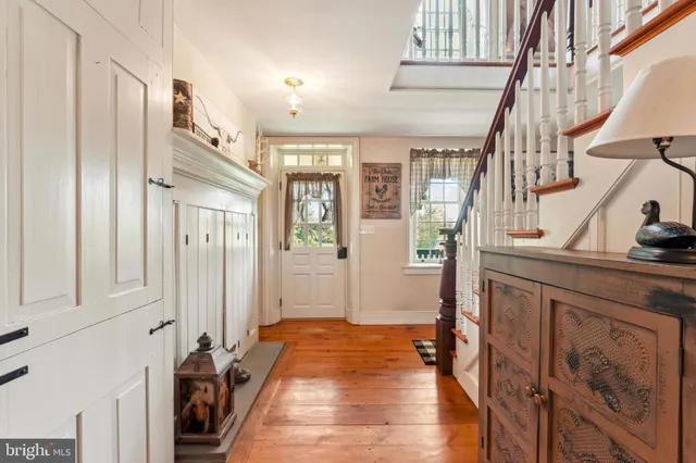 a living room with furniture flat screen tv and a fireplace