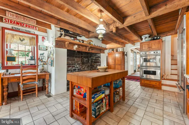 a large bathroom with a granite countertop sink a toilet and a shower