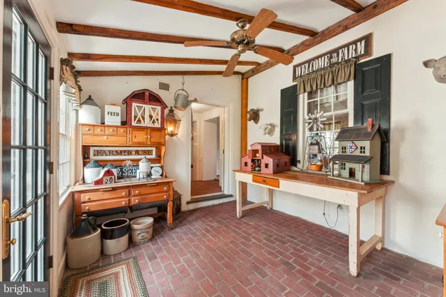 a bedroom with furniture and a window