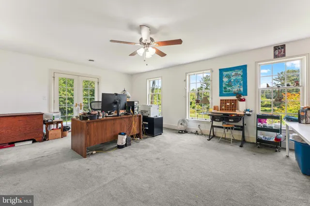 a street sign on a wall next to a road