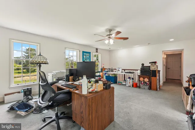 a view of a house with a yard and tree s