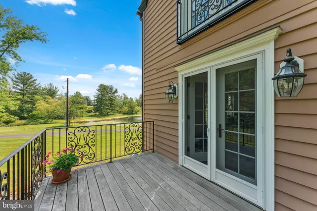 a bathroom with a sink mirror and toilet