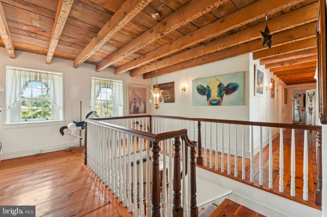 a view of a house with a backyard and porch