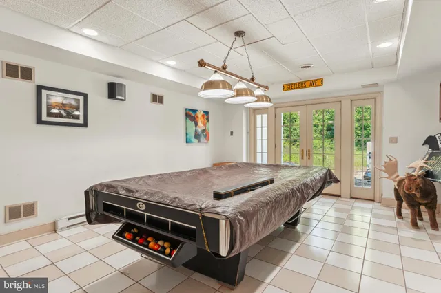 an aerial view of a house with yard swimming pool and outdoor seating