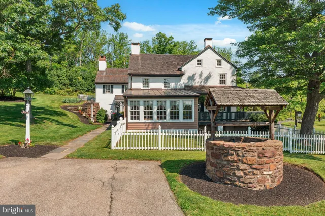 a view of a house with a yard porch and sitting area