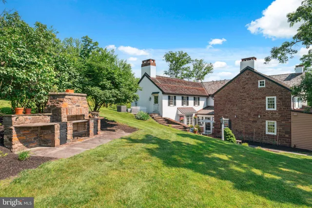 a patio with a table and chairs