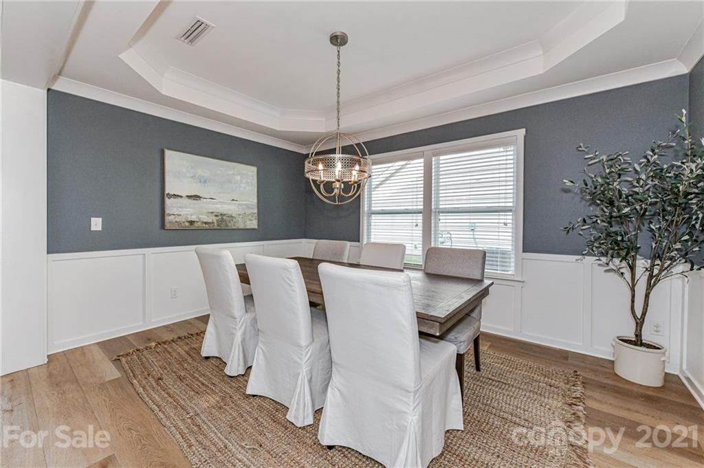 8074 Bryson Road Indian Land, SC 29707 - Photo 11 of 46 a dining room with furniture window and wooden floor