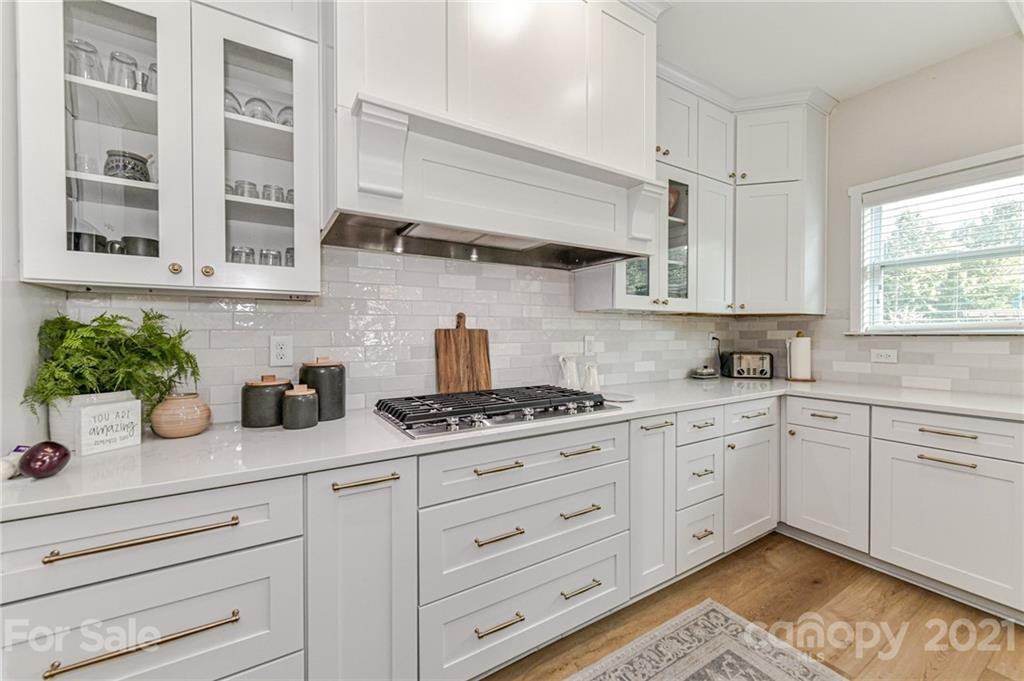 8074 Bryson Road Indian Land, SC 29707 - Photo 20 of 46 a kitchen with stainless steel appliances white cabinets and a window