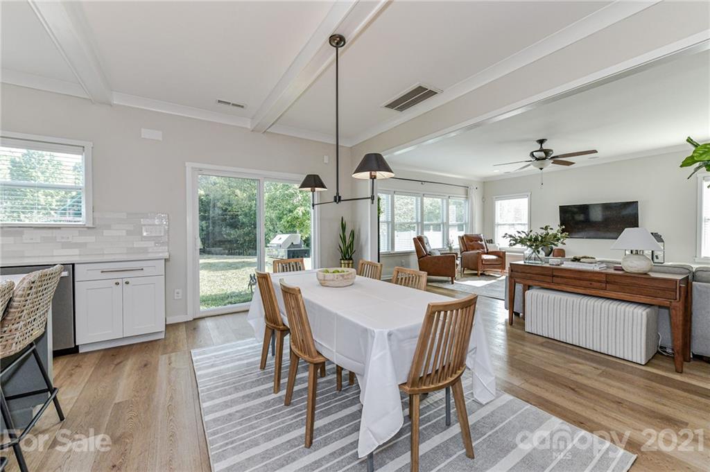 8074 Bryson Road Indian Land, SC 29707 - Photo 23 of 46 a view of a dining room with furniture window and wooden floor