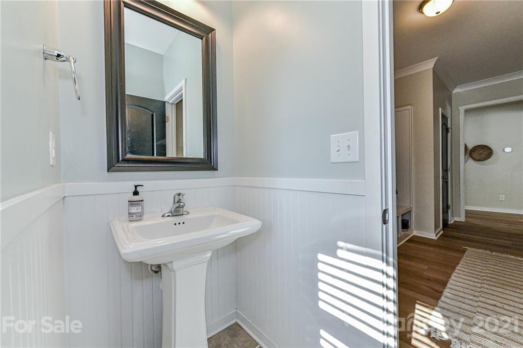 8074 Bryson Road Indian Land, SC 29707 - Photo 26 of 46 a bathroom with a sink and a mirror