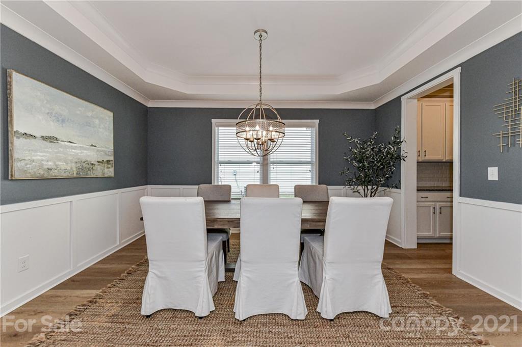 8074 Bryson Road Indian Land, SC 29707 - Photo 9 of 46 a view of a dining room with furniture window and wooden floor