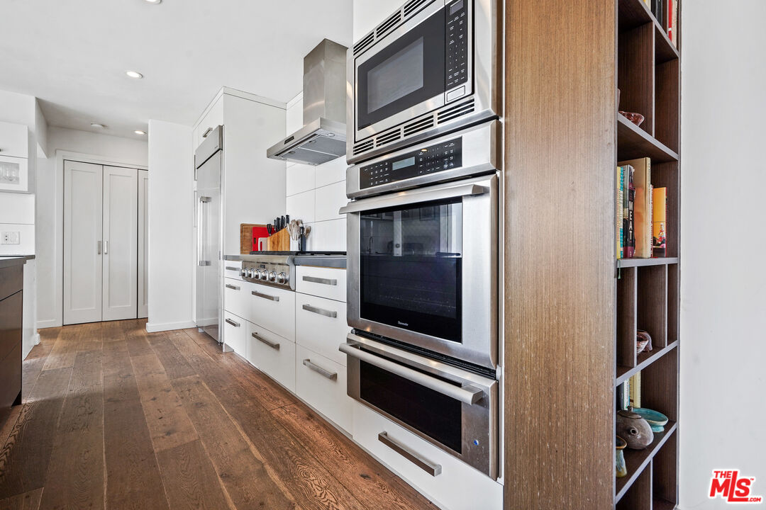 27861 Winding Way Malibu, CA 90265 - Photo 13 of 36 a kitchen with stainless steel appliances and cabinets