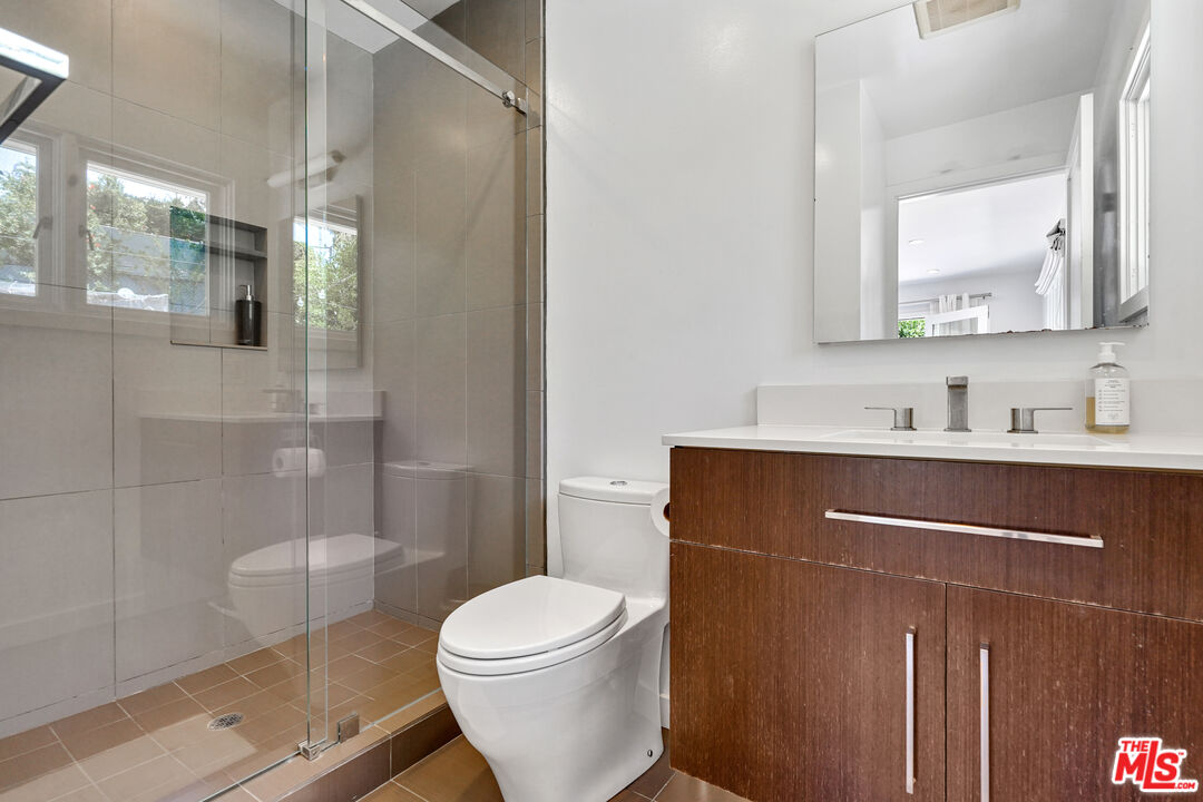 27861 Winding Way Malibu, CA 90265 - Photo 19 of 36 a bathroom with a sink a toilet and shower