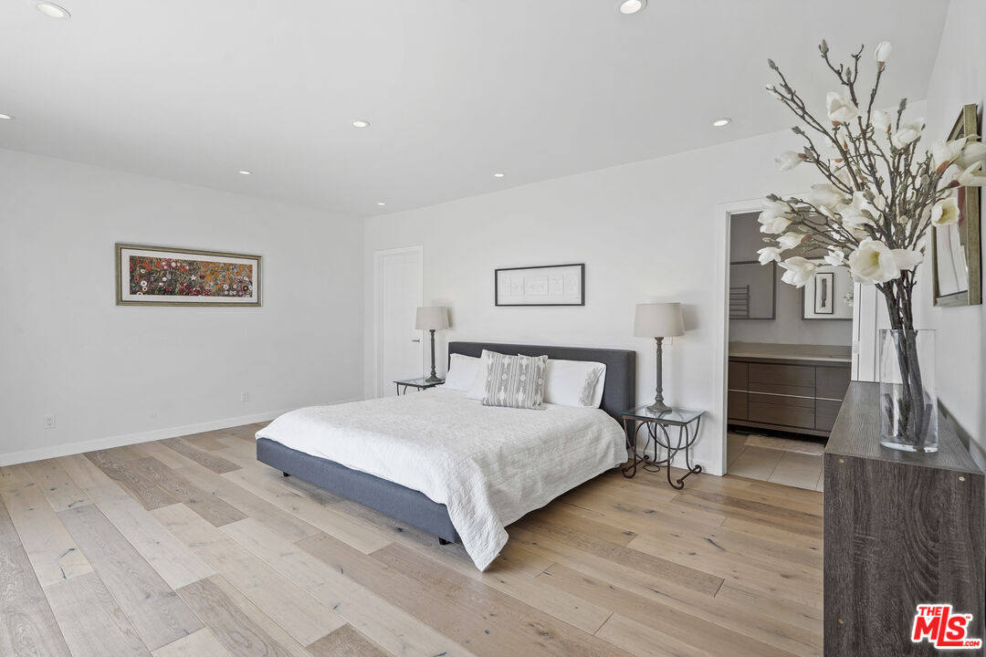 27861 Winding Way Malibu, CA 90265 - Photo 20 of 36 a bedroom with a large bed and a couch