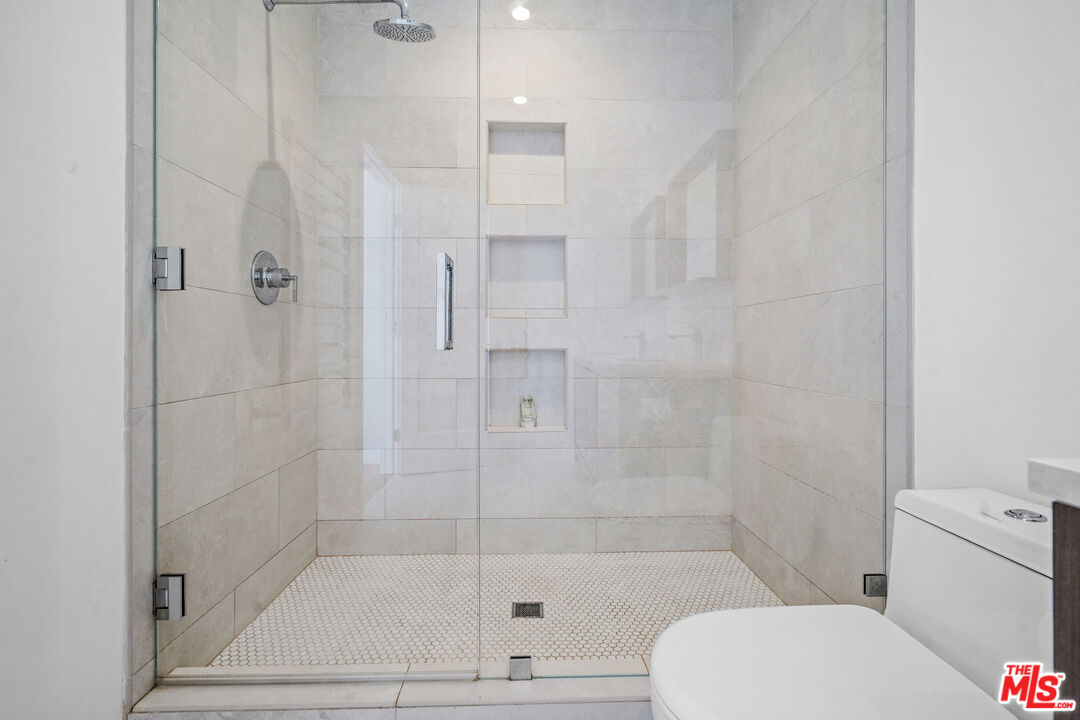 27861 Winding Way Malibu, CA 90265 - Photo 23 of 36 a bathroom with a shower and a toilet