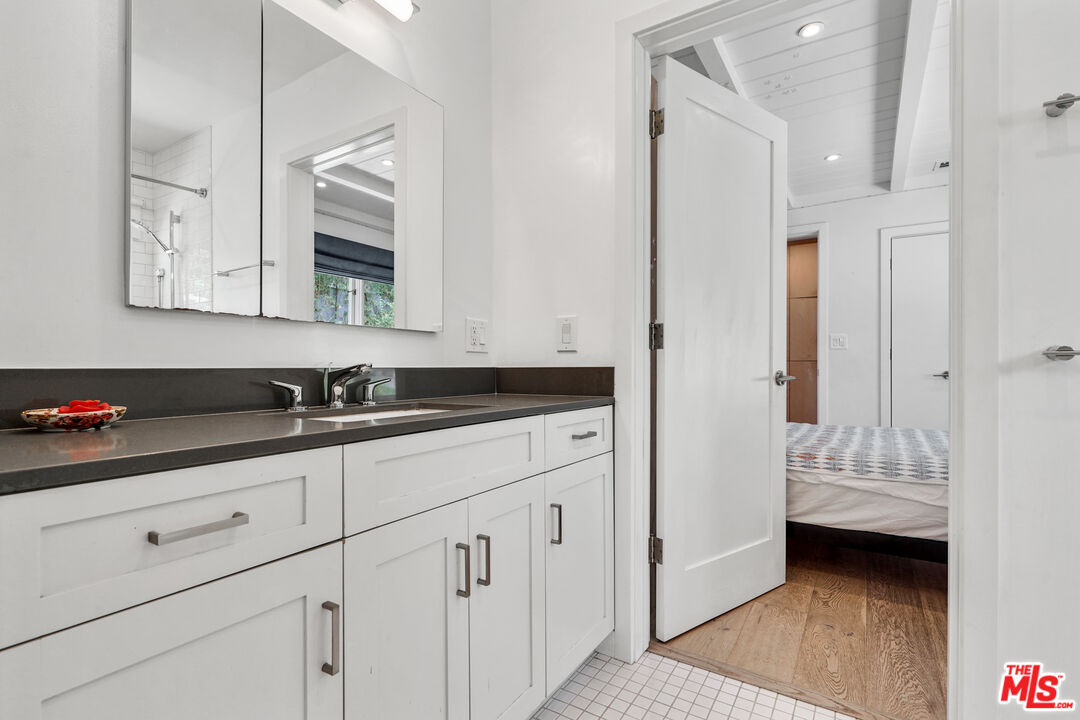 27861 Winding Way Malibu, CA 90265 - Photo 25 of 36 a bathroom with a sink and a mirror