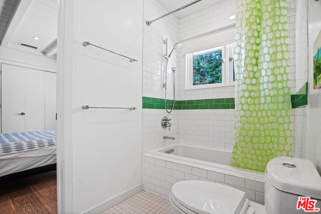 27861 Winding Way Malibu, CA 90265 - Photo 26 of 36 a bathroom with a granite countertop toilet sink and tub