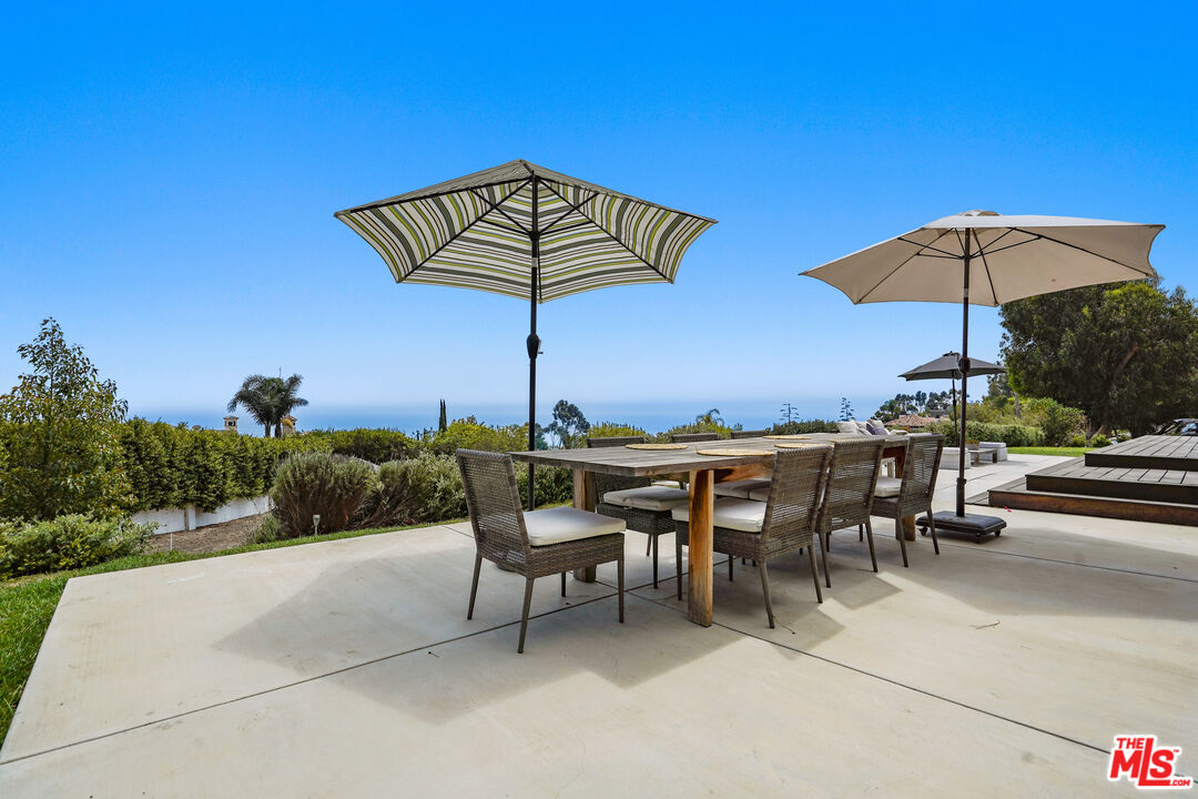 27861 Winding Way Malibu, CA 90265 - Photo 28 of 36 a view of a chairs and table in patio with a fire pit