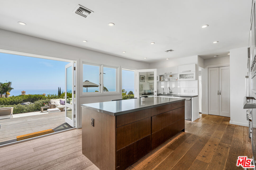27861 Winding Way Malibu, CA 90265 - Photo 5 of 36 a kitchen with counter top space sink and refrigerator