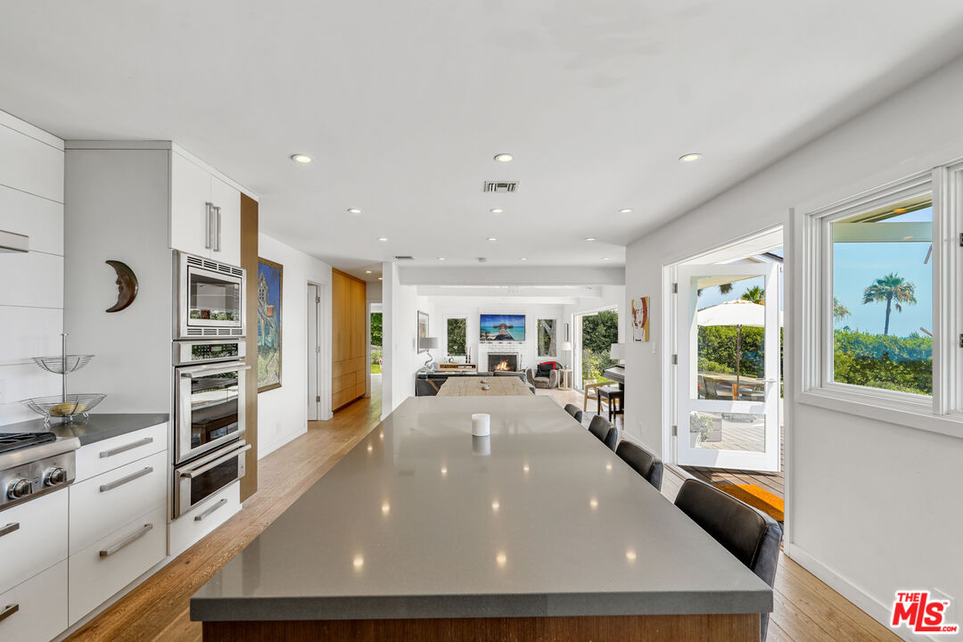 27861 Winding Way Malibu, CA 90265 - Photo 7 of 36 a view of a living room and a large window