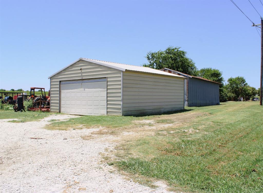 650 Lone Star Road Whitesboro, TX 76273 - Photo 15 of 18 a house with a yard