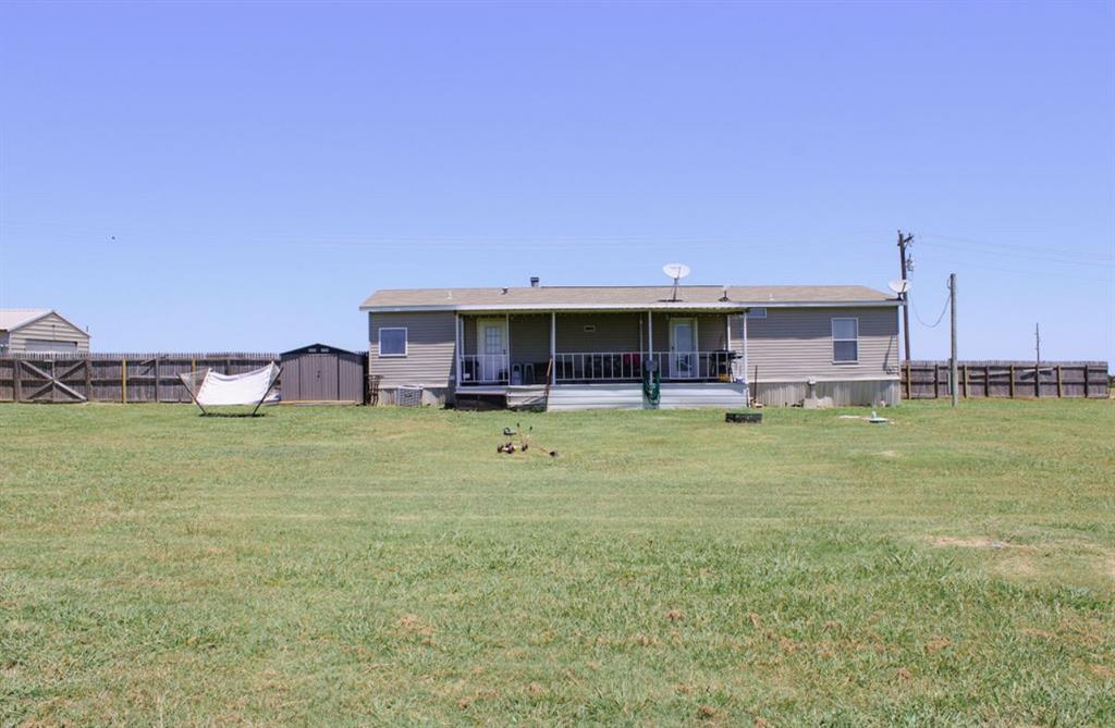 650 Lone Star Road Whitesboro, TX 76273 - Photo 16 of 18 a view of an house with backyard space and balcony