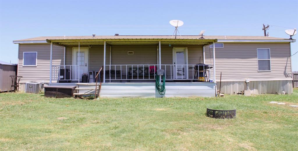 650 Lone Star Road Whitesboro, TX 76273 - Photo 17 of 18 a backyard of a house with seating area