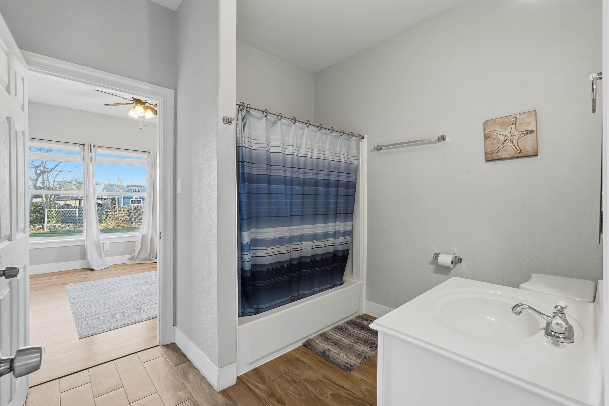 308 East Phillips Street Conroe, TX 77301 - Photo 15 of 36 a bathroom with a sink and a shower