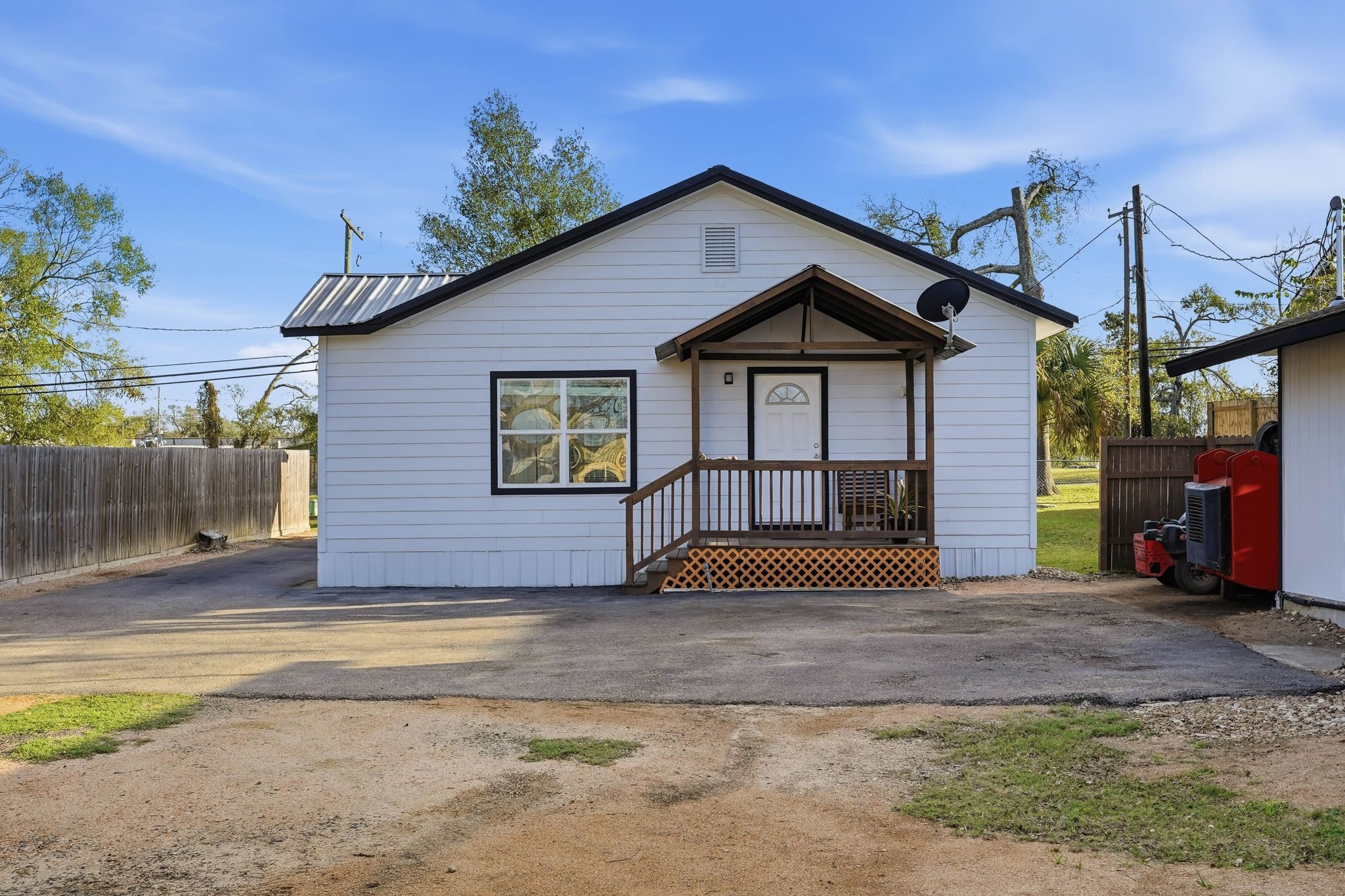 308 East Phillips Street Conroe, TX 77301 - Photo 26 of 36 a front view of a house with a yard