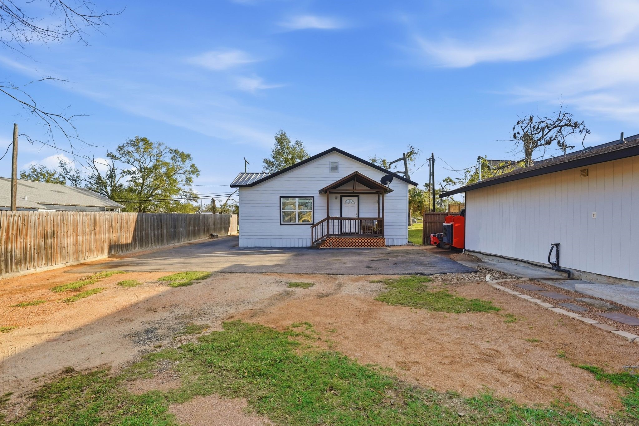 308 East Phillips Street Conroe, TX 77301 - Photo 29 of 36 a front view of a house with a yard and garage