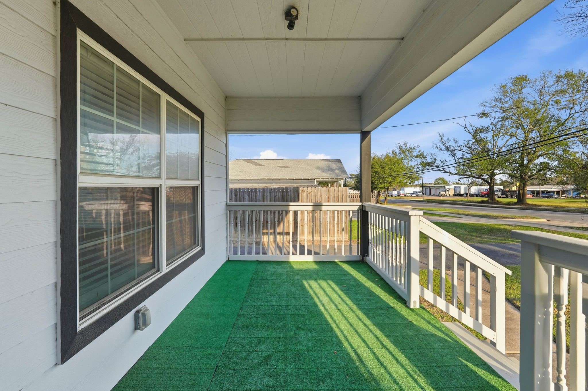 308 East Phillips Street Conroe, TX 77301 - Photo 5 of 36 a view of a porch with a yard