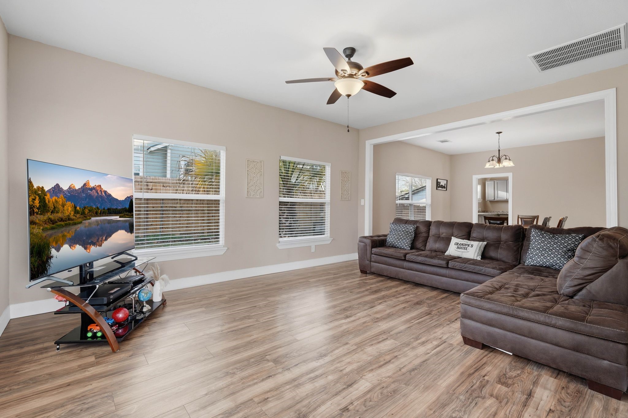308 East Phillips Street Conroe, TX 77301 - Photo 6 of 36 a living room with furniture a dining table and a window