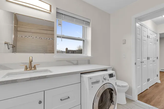 a view of bathroom with dual sinks
