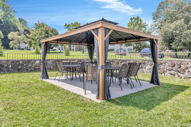 a front view of house with yard and trees