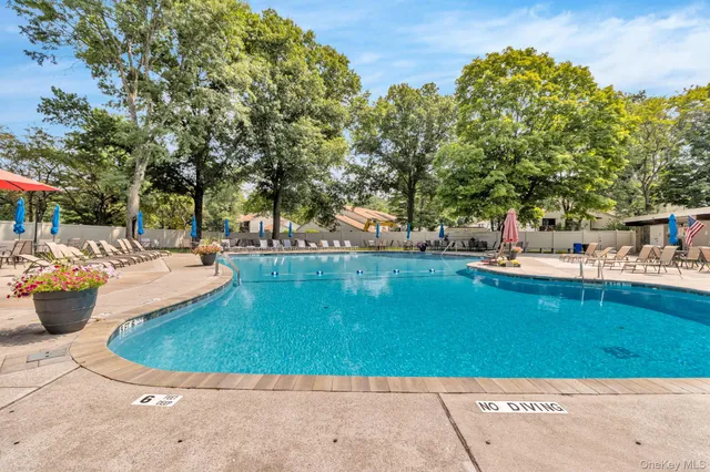 a view of a porch with furniture and garden