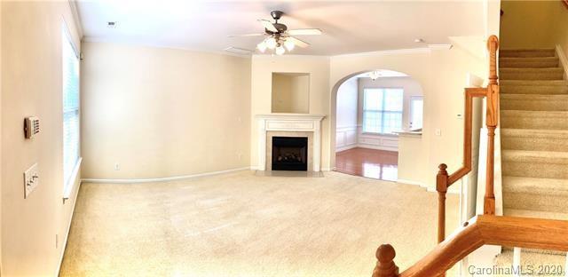 1140 Hammond Drive Matthews, NC 28104 - Photo 3 of 17 a view of an empty room with a fireplace