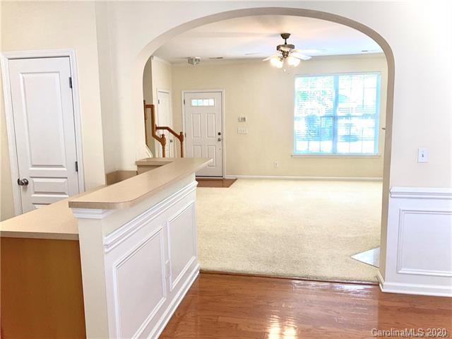 1140 Hammond Drive Matthews, NC 28104 - Photo 5 of 17 a bathroom with a sink a vanity and a mirror