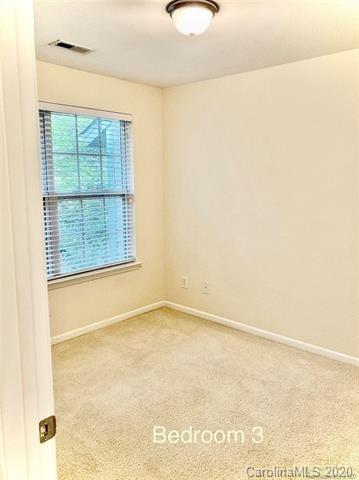 1140 Hammond Drive Matthews, NC 28104 - Photo 7 of 17 a view of an empty room with a window