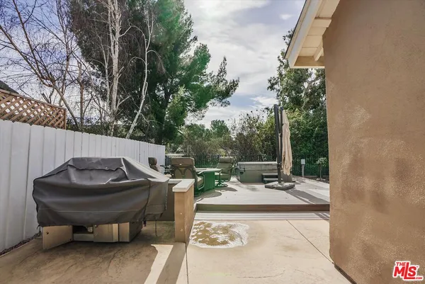 a view of a backyard with sitting area
