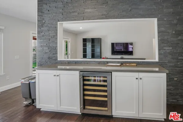 a kitchen with a sink and a microwave