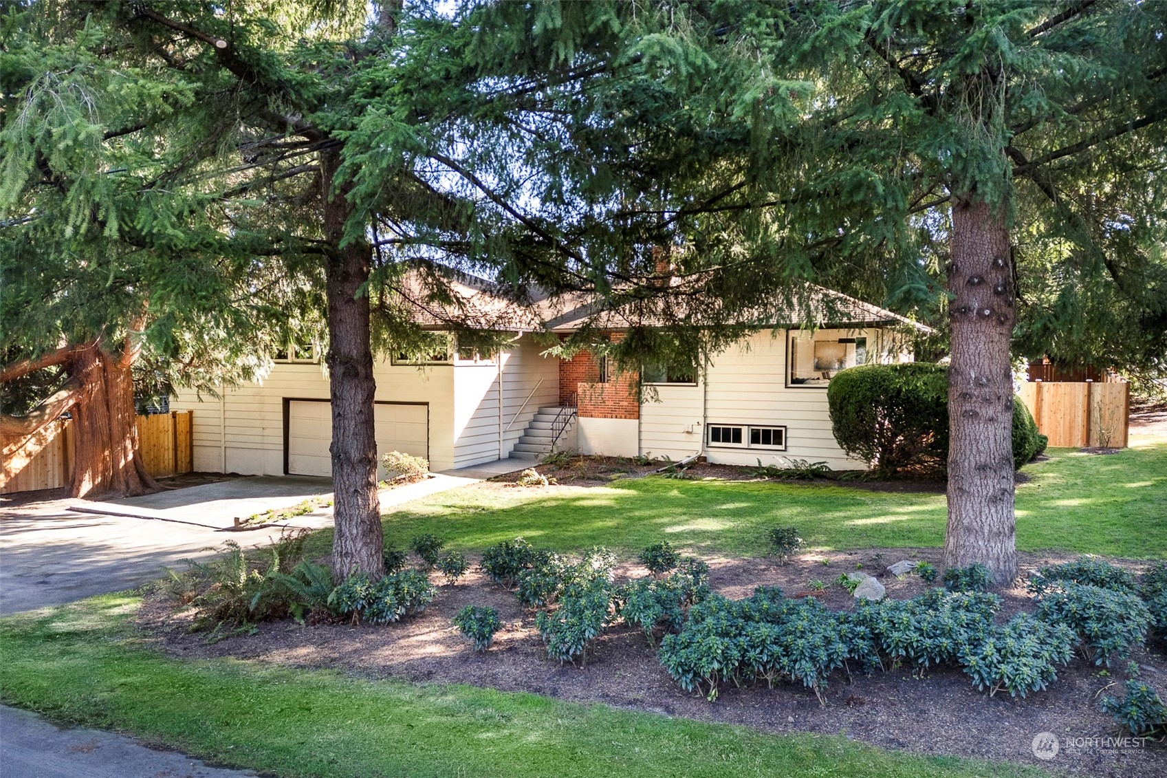 3203 Northeast 88th Street Seattle, WA 98115 - Photo 1 of 28 a front view of a house with garden