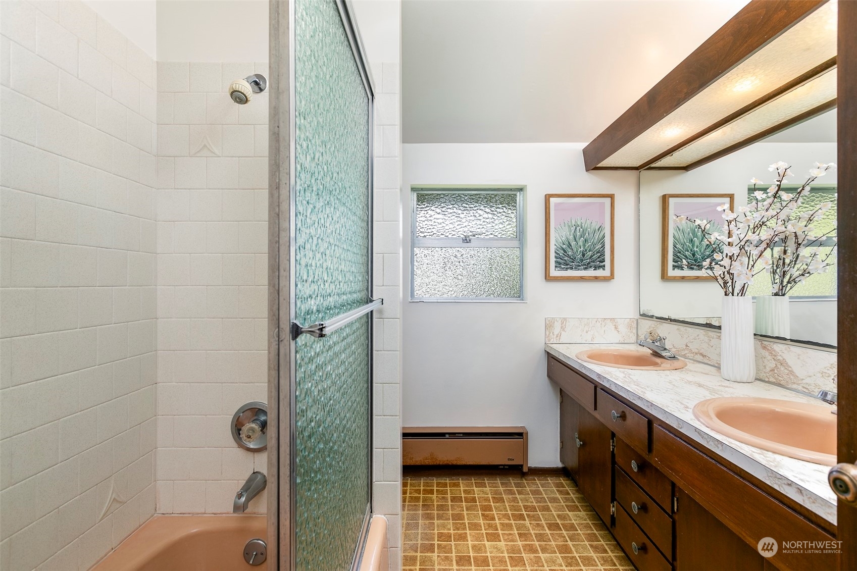 3203 Northeast 88th Street Seattle, WA 98115 - Photo 13 of 28 a bathroom with a sink a toilet and shower