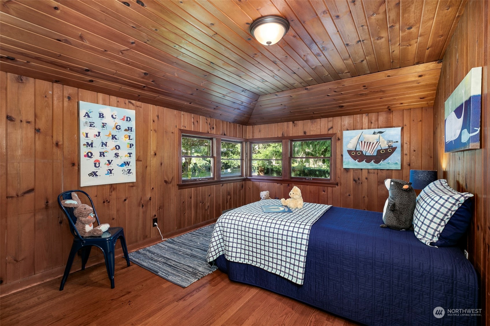 3203 Northeast 88th Street Seattle, WA 98115 - Photo 16 of 28 a bed room with a bed and a chair