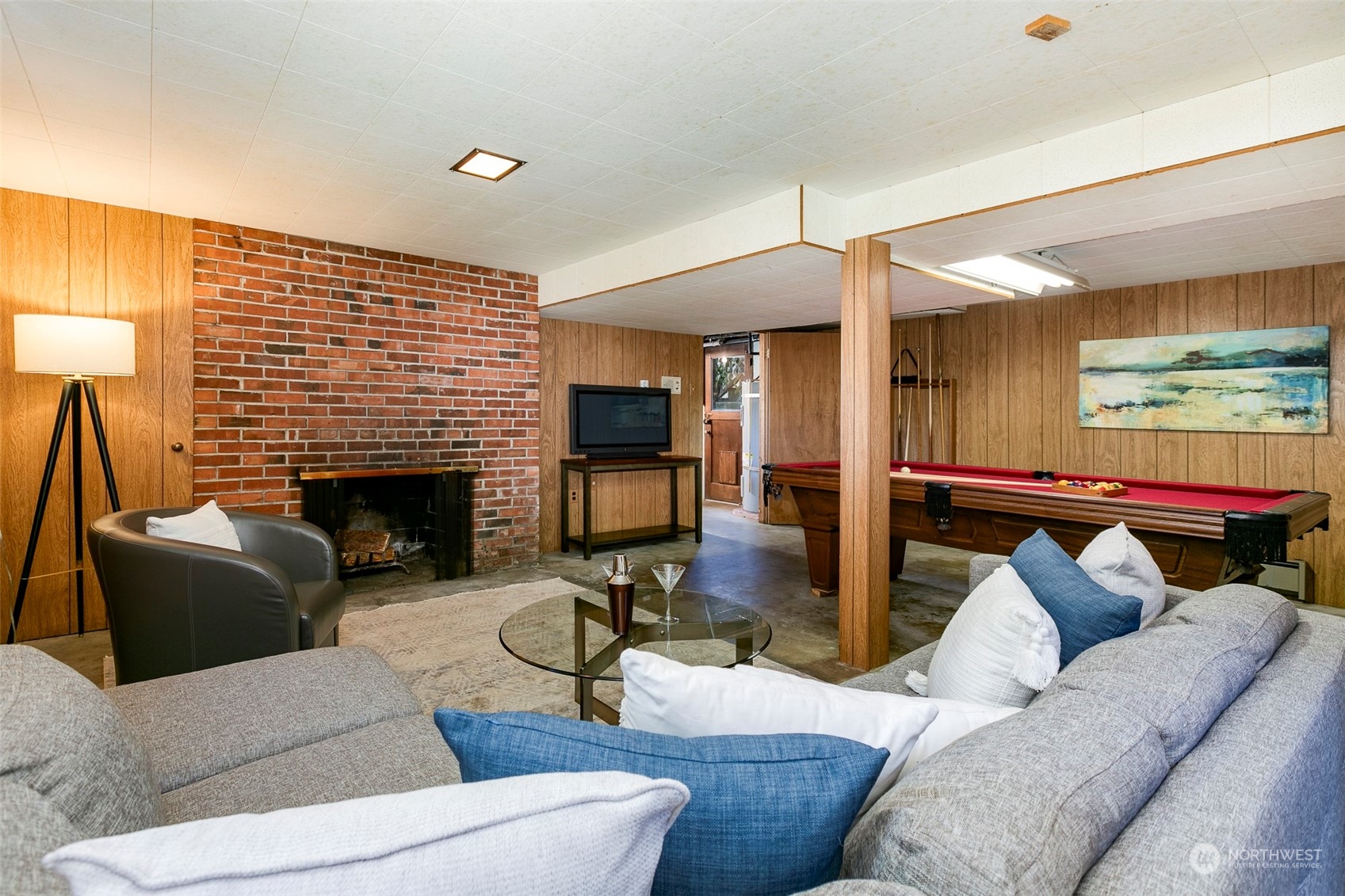3203 Northeast 88th Street Seattle, WA 98115 - Photo 17 of 28 a living room with furniture and a fireplace