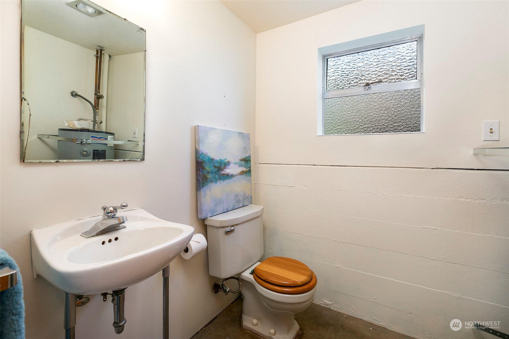 3203 Northeast 88th Street Seattle, WA 98115 - Photo 18 of 28 a bathroom with a toilet sink and mirror