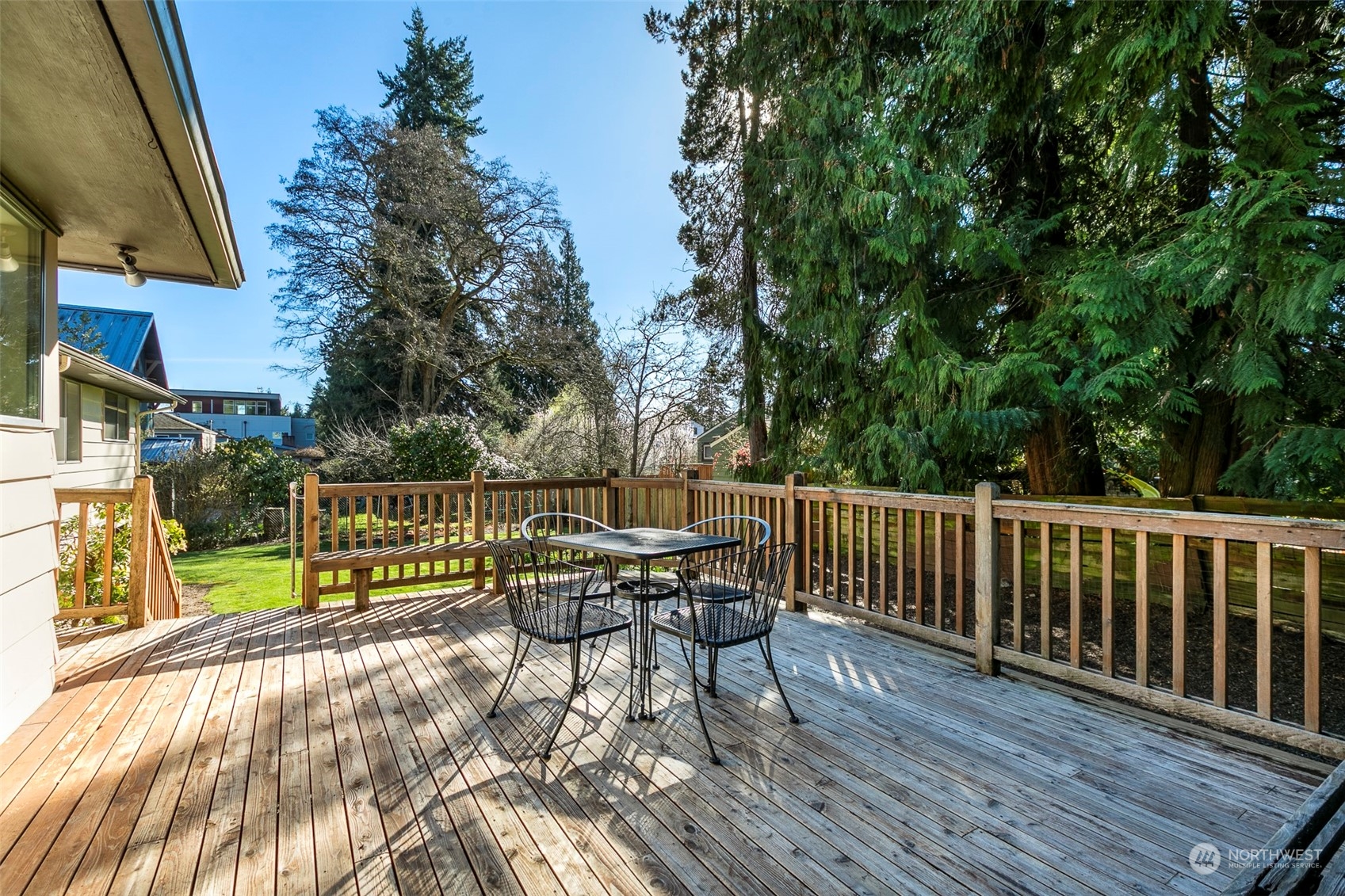 3203 Northeast 88th Street Seattle, WA 98115 - Photo 22 of 28 a view of balcony with wooden floor and outdoor seating