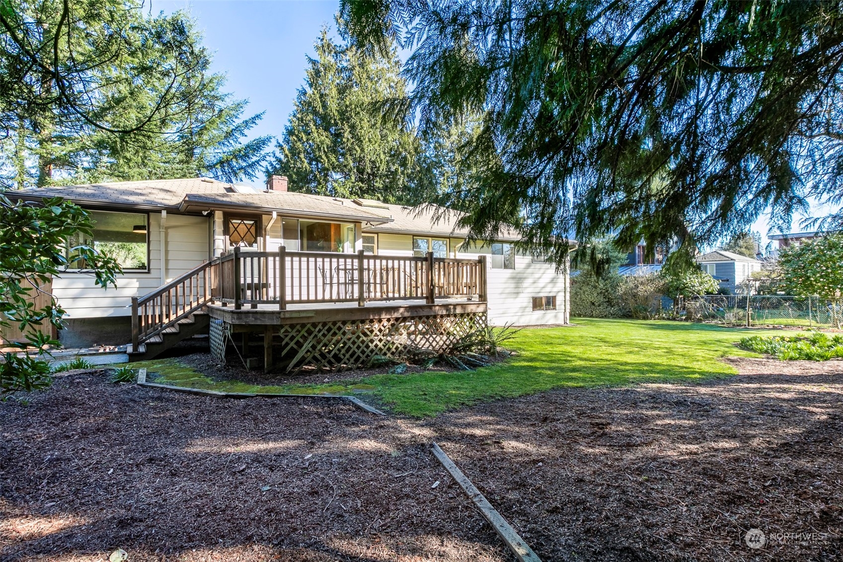 3203 Northeast 88th Street Seattle, WA 98115 - Photo 23 of 28 a front view of a house with garden